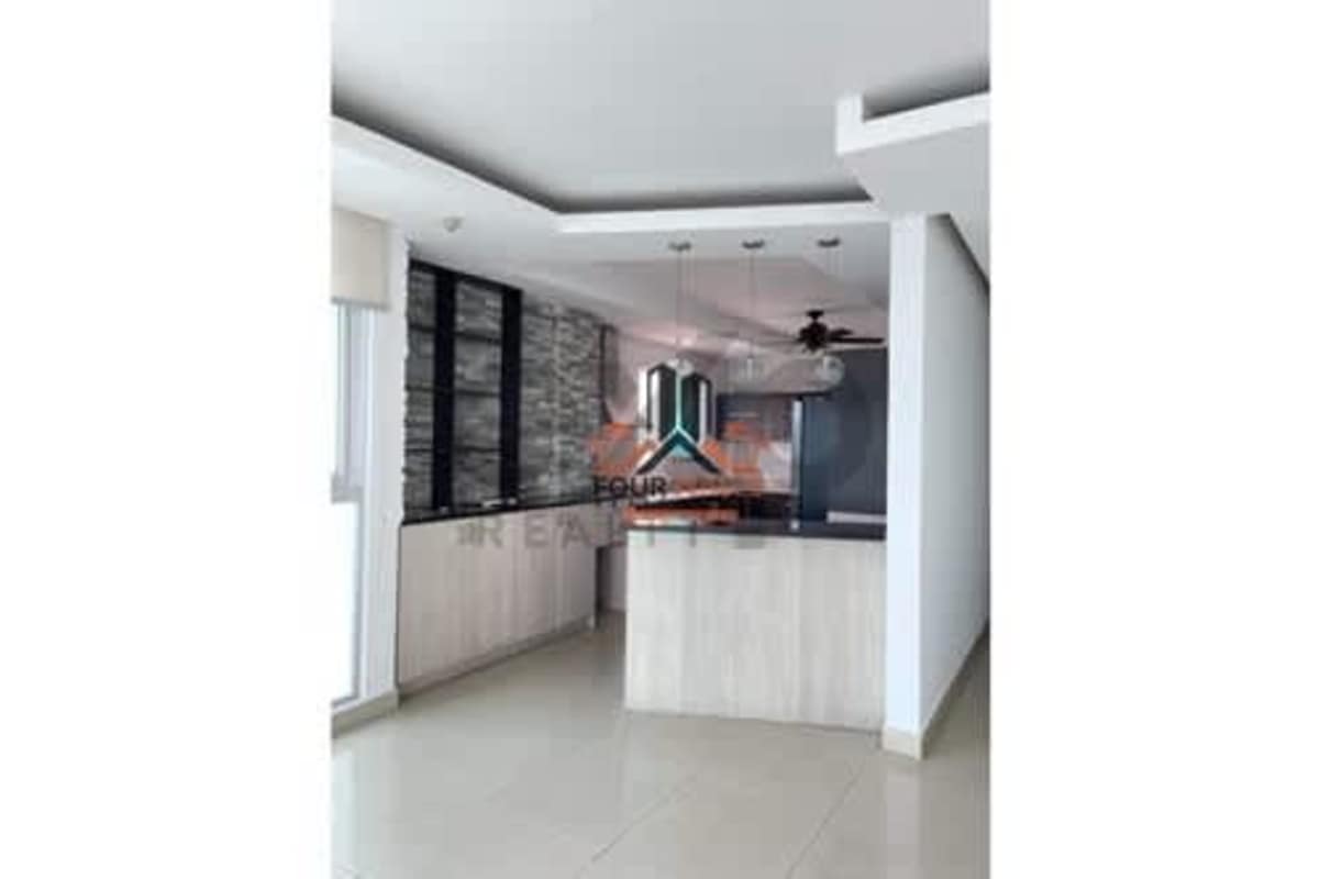 Stylish modern kitchen with island, pendant lights and stone backsplash in PH The View Coco del Mar Panama