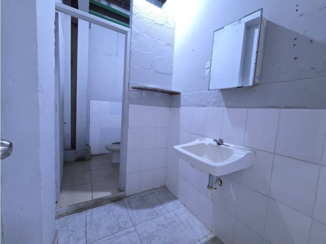 Commercial property bathroom with tiled walls, sink, and toilet Justo Arosemena Avenue Calidonia Panama