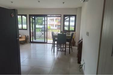 Dining area with glass doors opening to garden balcony in Brisas de Coronado Coronado Panama
