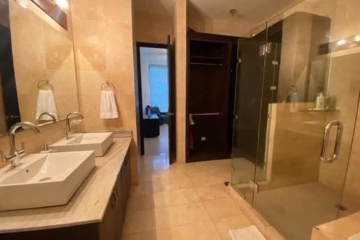 Contemporary living room with burgundy leather sofa panoramic window PH Bahía del Amador