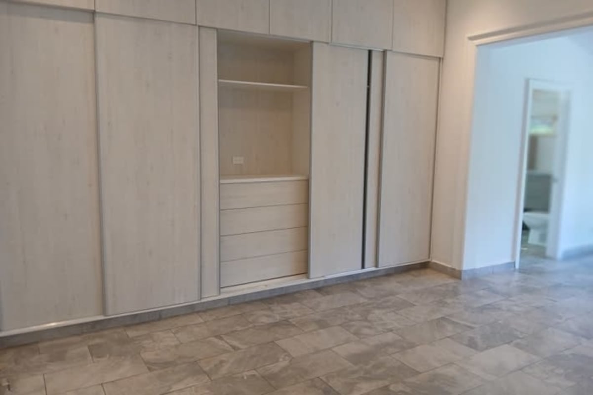 Large walk-in closet marble feature Altos del Golf luxury residence Panama City