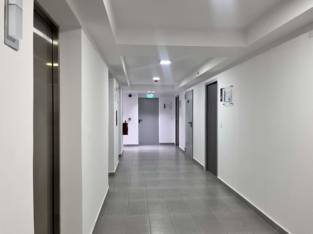 Modern minimalist office with white desk large window abstract art Park Square Medical Center Panama