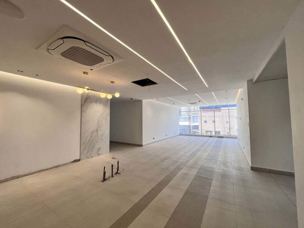 Large open commercial space with windows marble wall recessed lights Via España Park Square Panama