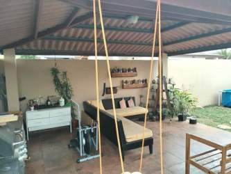 Covered patio terrace with outdoor lounge space Brisas del Golf Arraiján Panama