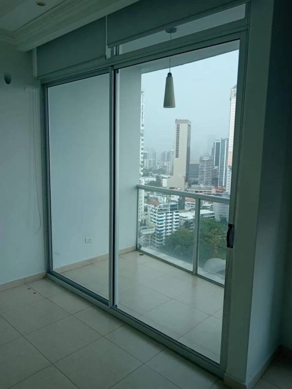 Elegant bedroom with ocean view window in Belle View Tower Panama City