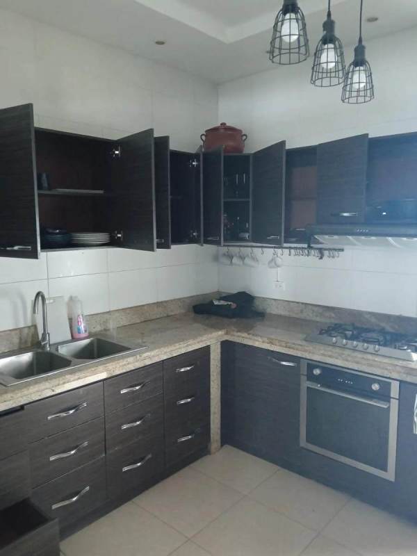 Kitchen with granite countertops, modern cabinetry Belle View Tower Panama