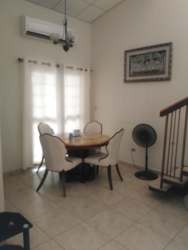 Two story duplex townhouse with covered carport fenced garden La Fontana David Panama