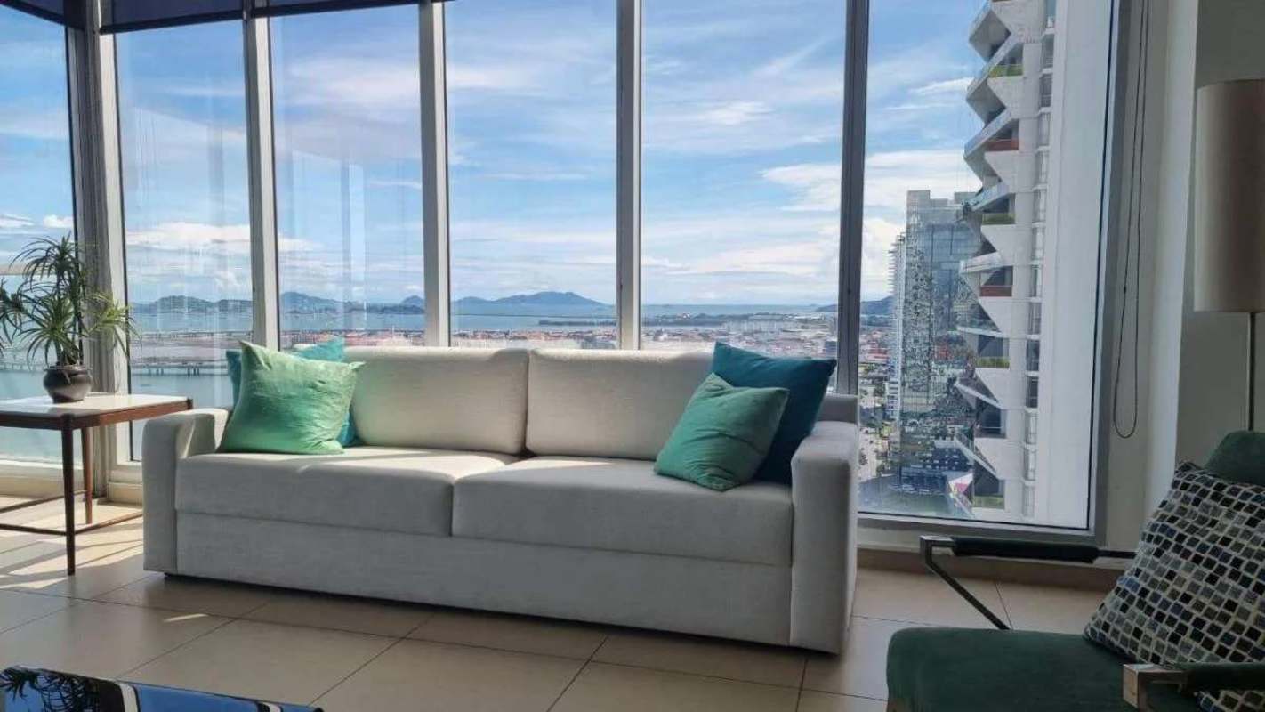 Modern bedroom with panoramic views of the city and ocean in apartment PH BICSA Tower Avenida Balboa Panama