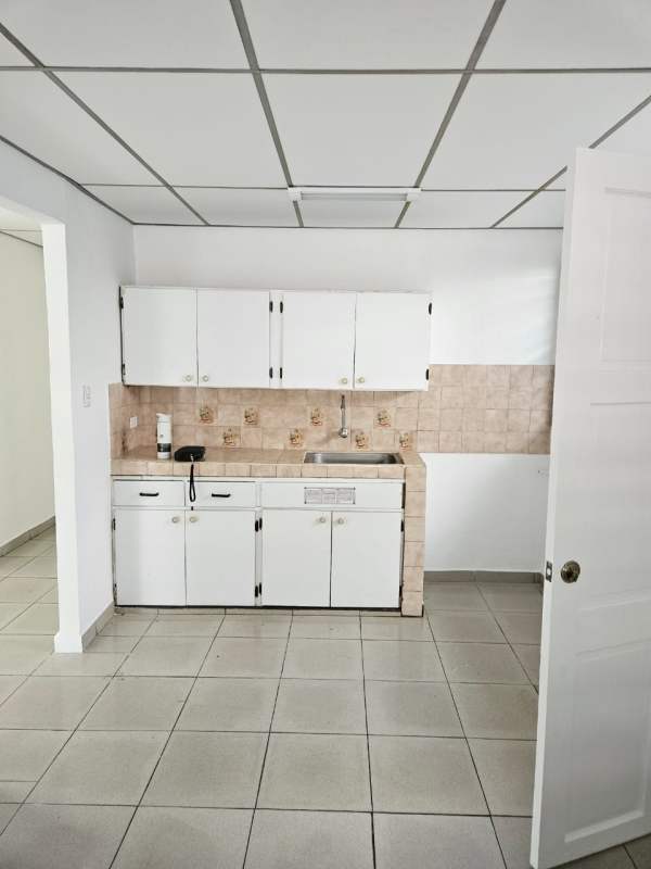 Living room with tiled floor and windows with security bars Urbanizacion Don Bosco Panama