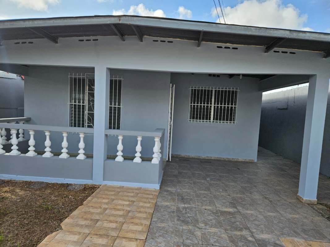 Compact kitchen with white cabinets tile backsplash and stainless sink Urbanizacion Don Bosco Panama City