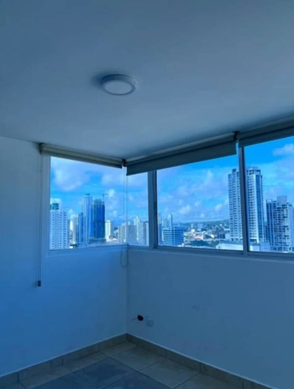 Rooftop pool and lounge with city skyline backdrop at PH Crystal Blue Panama City