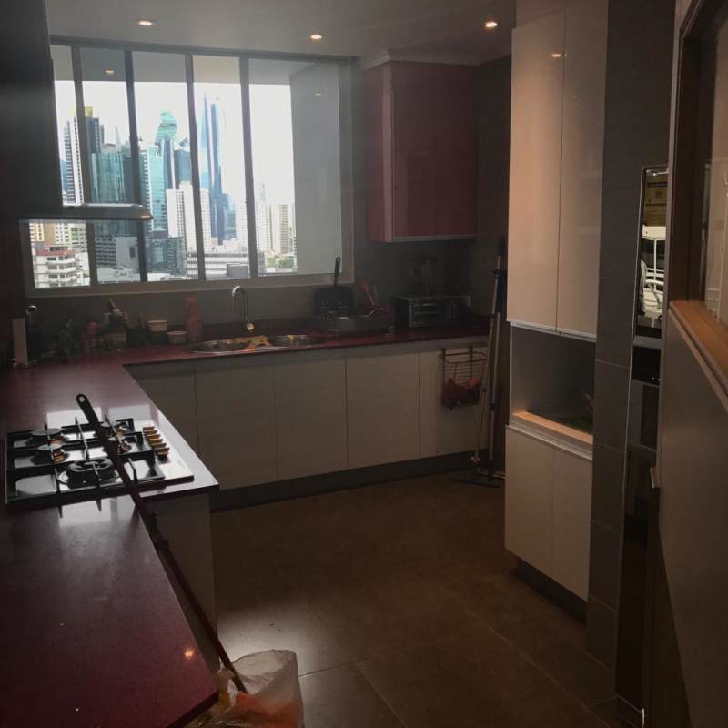 Modern kitchen with red countertops and skyline view in PH Cangrejo Center Heights El Cangrejo Panama