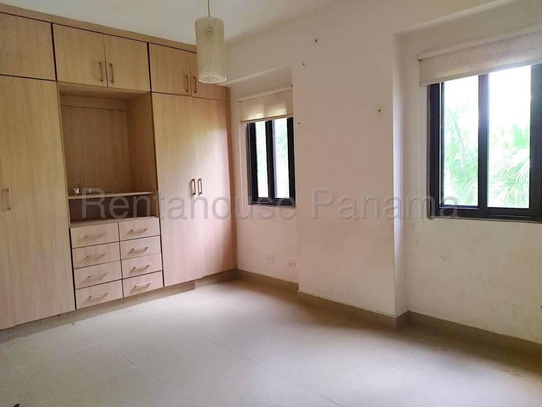 Covered balcony overlooking lush gardens in PH Embassy Village Clayton Panama