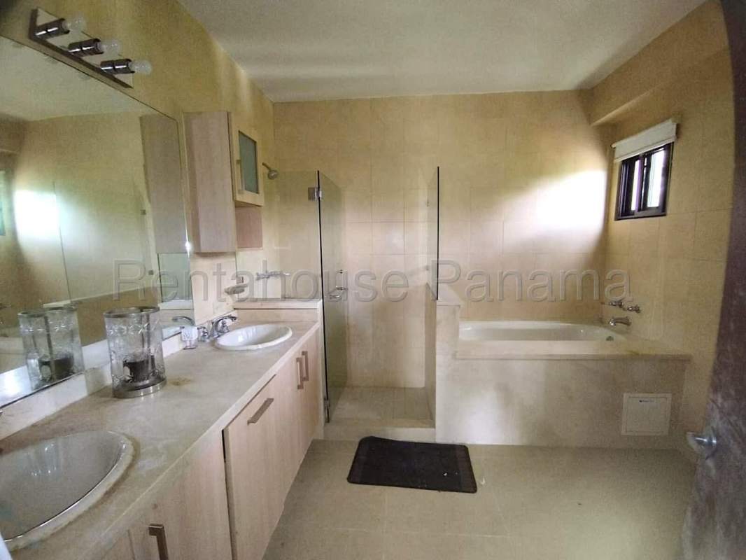 Community pool area with loungers at PH Embassy Village Clayton Panama