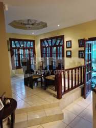 Traditional wooden kitchen cabinets tiled counter single story house Las Tablas sale