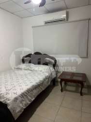 Bedroom with large closet, ceiling fan, and traditional decor house sale Las Tablas