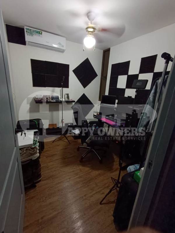 Bedroom with desk area, AC unit, wood floor PH Torres del Rey Hato Pintado