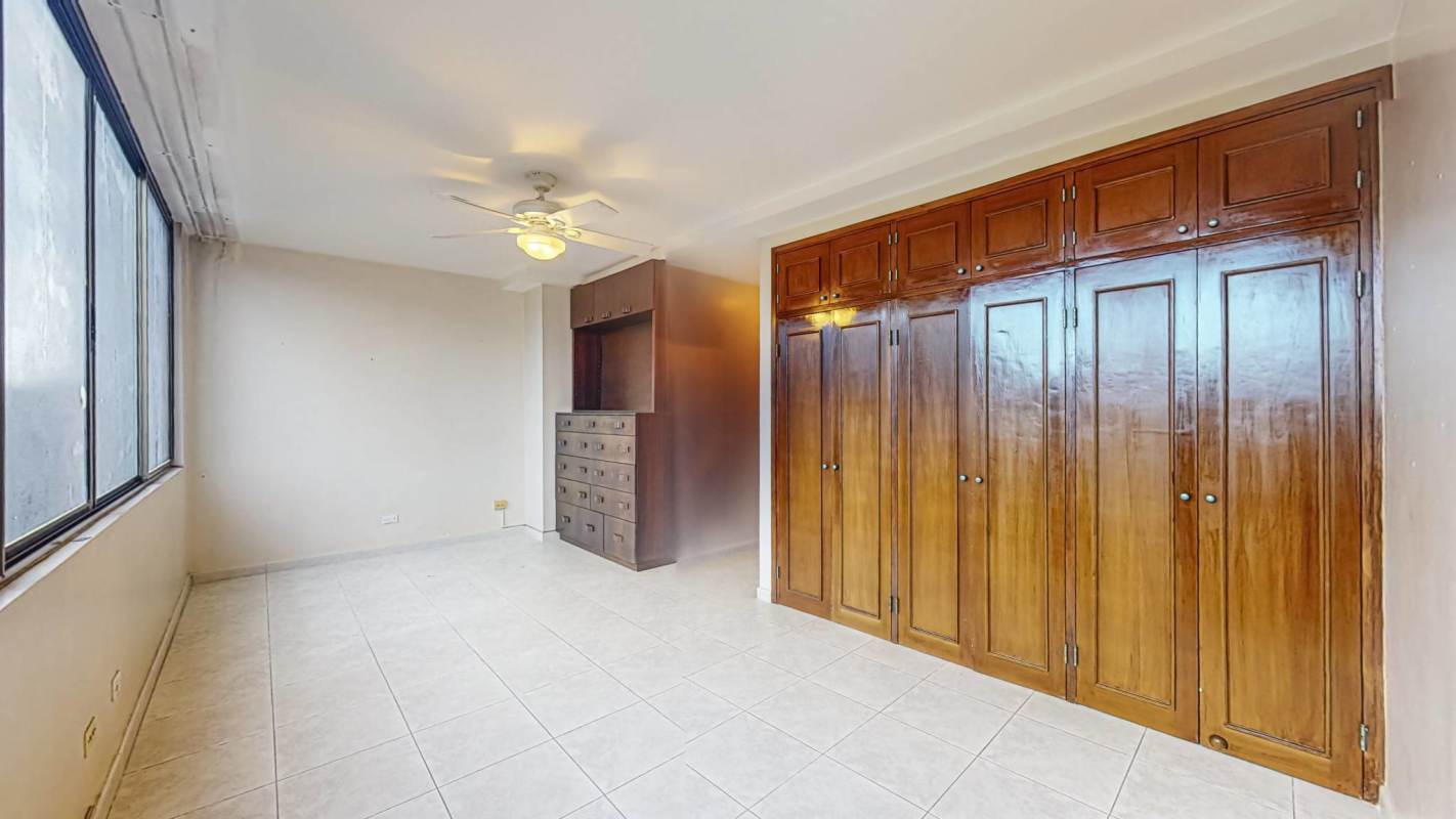 Large bedroom with tiled floor, city views, air conditioner PH Torre Cerromar Panama