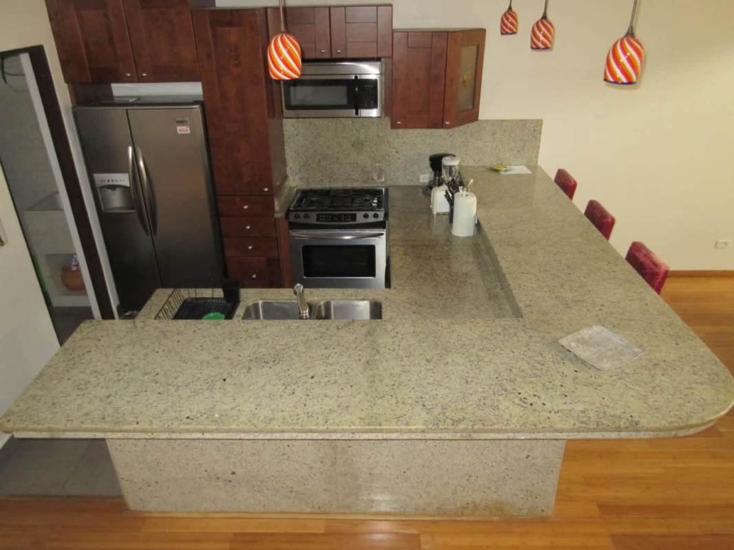 Contemporary kitchen with granite counters stainless appliances PH Embassy Club Clayton