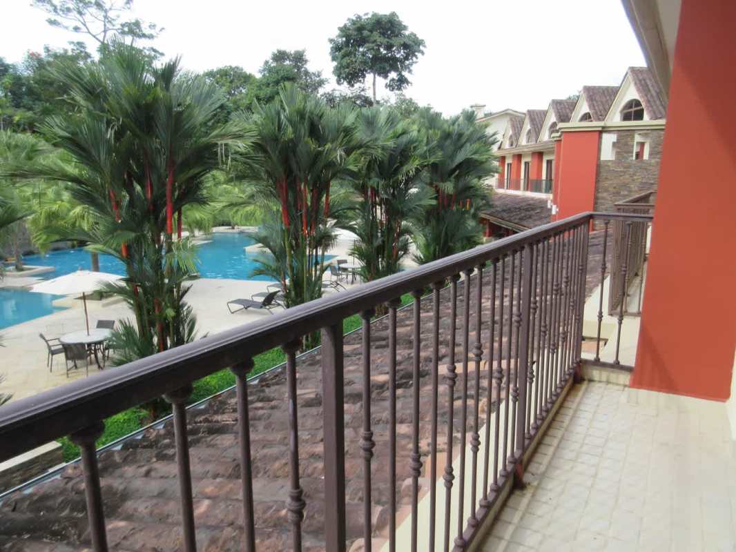 Resort-style swimming pool tropical landscaping in Embassy Club Clayton Panama