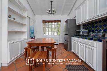 Beautiful landscaped private garden and pond with decorative footbridge at luxury estate Volcán Panama