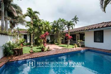 Aerial photo of sprawling Volcán Panama estate with gardens, pond, pool, and mountain scenery