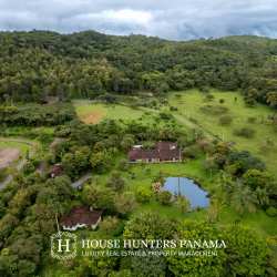 Spanish Colonial covered terrace with garden and pool at luxury estate in Volcán Panama