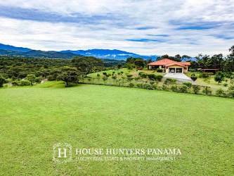 Aerial of rural land plot outlined amid lush greenery and adjacent properties in Chiriquí Panama near Boquete