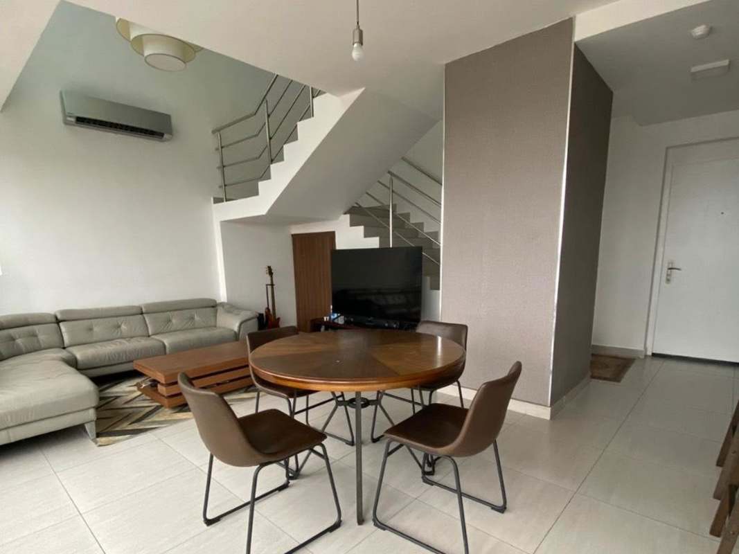 Modern open plan duplex living room dining staircase in PH Coco del Mar Panama
