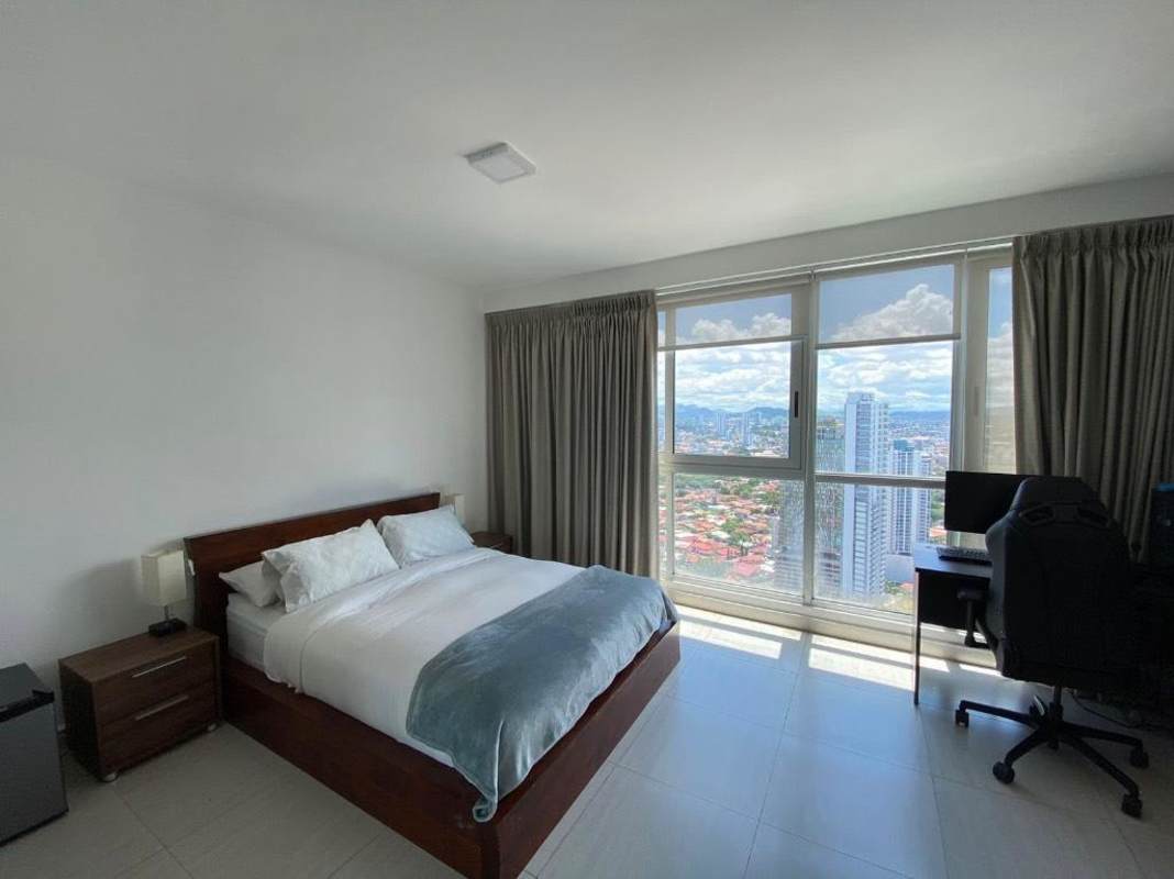 Spacious master bedroom with large window city and partial ocean view PH Coco del Mar Panama