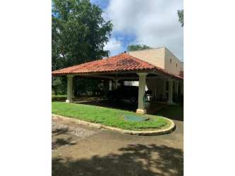 Guest house with tile roof amid mature gardens in luxury estate Chitré Panama