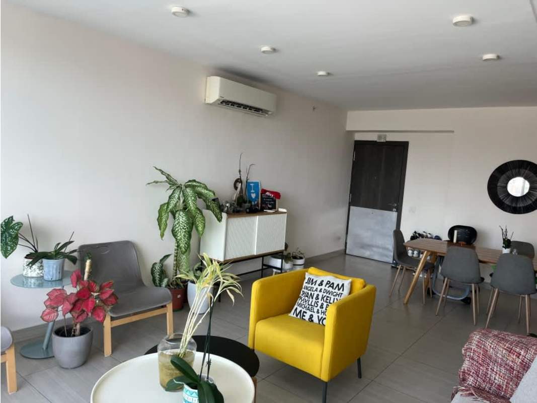 Minimalist living room with sectional sofa, big window and skyline views PH Asia Panama
