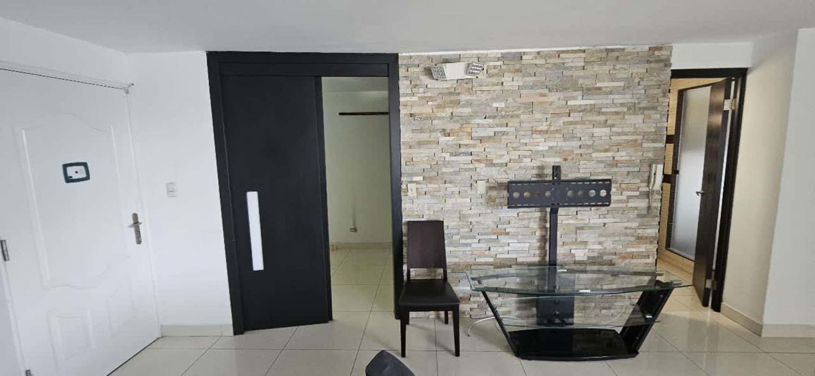 Glass dining table, large windows, modern design apartment PH San Miguelito Suites Panama