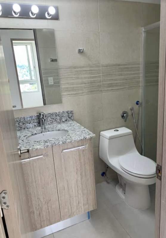 Bathroom with granite countertop glass-enclosed shower modern fixtures in PH Green Wood Tumba Muerto