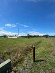 Open flat lot with green grass and sky ideal for residential project near Coronado beach