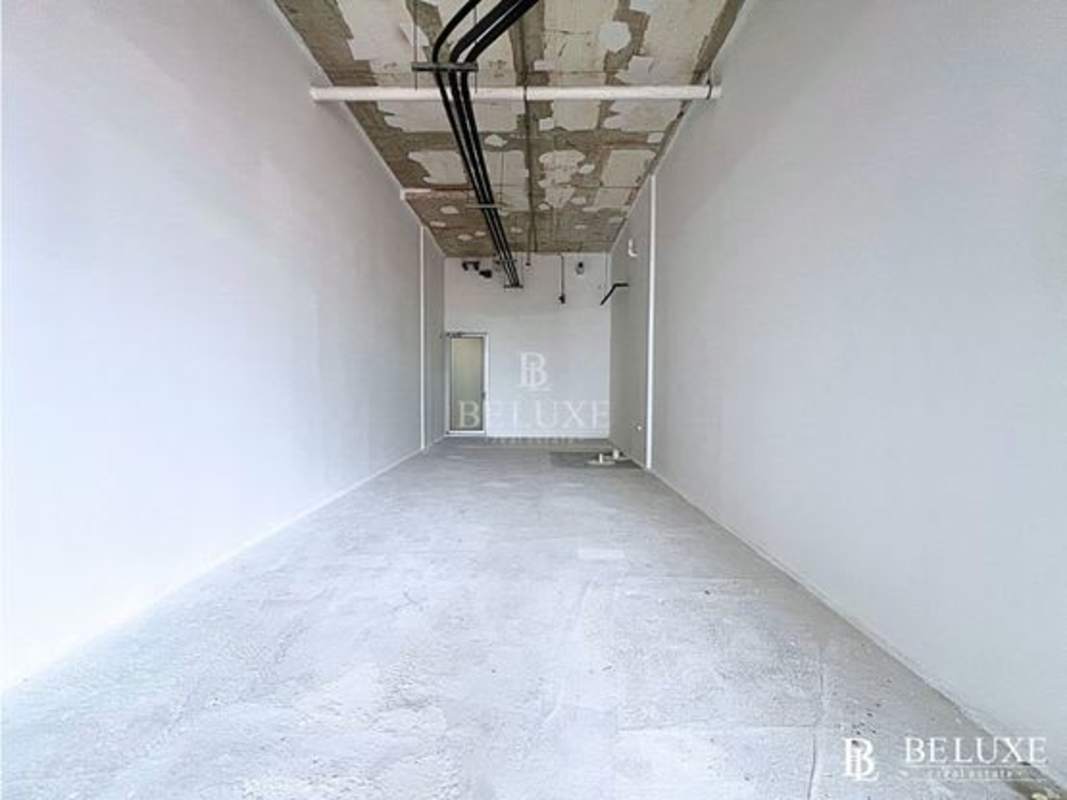 Kids' indoor playroom with colorful jungle mural and activity panel at Town Center Costa del Este