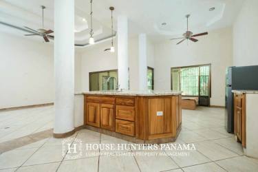 Large kitchen with center island, wooden cabinets, ceramic tile Sortova Bugaba Panama