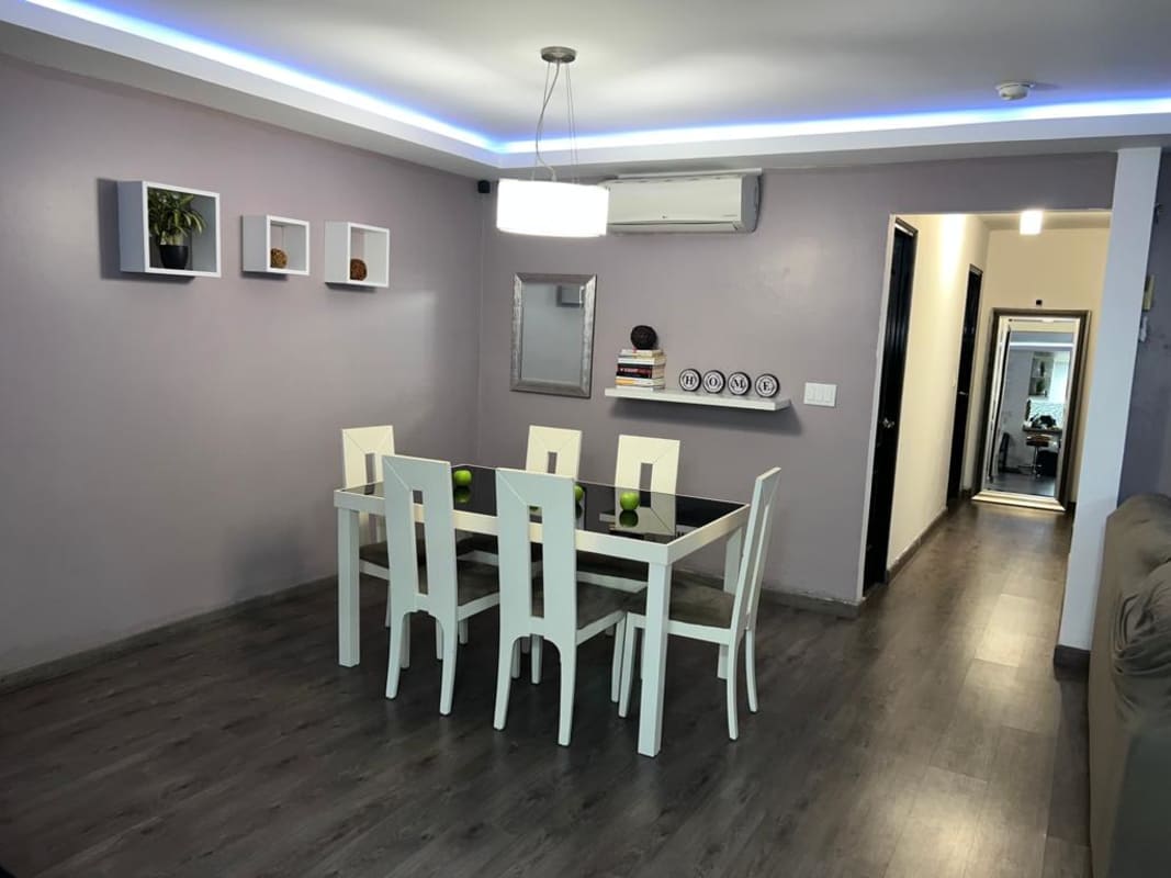 Modern open kitchen with granite countertops, ceramic backsplash, and appliances in PH Onyx Tower Panama