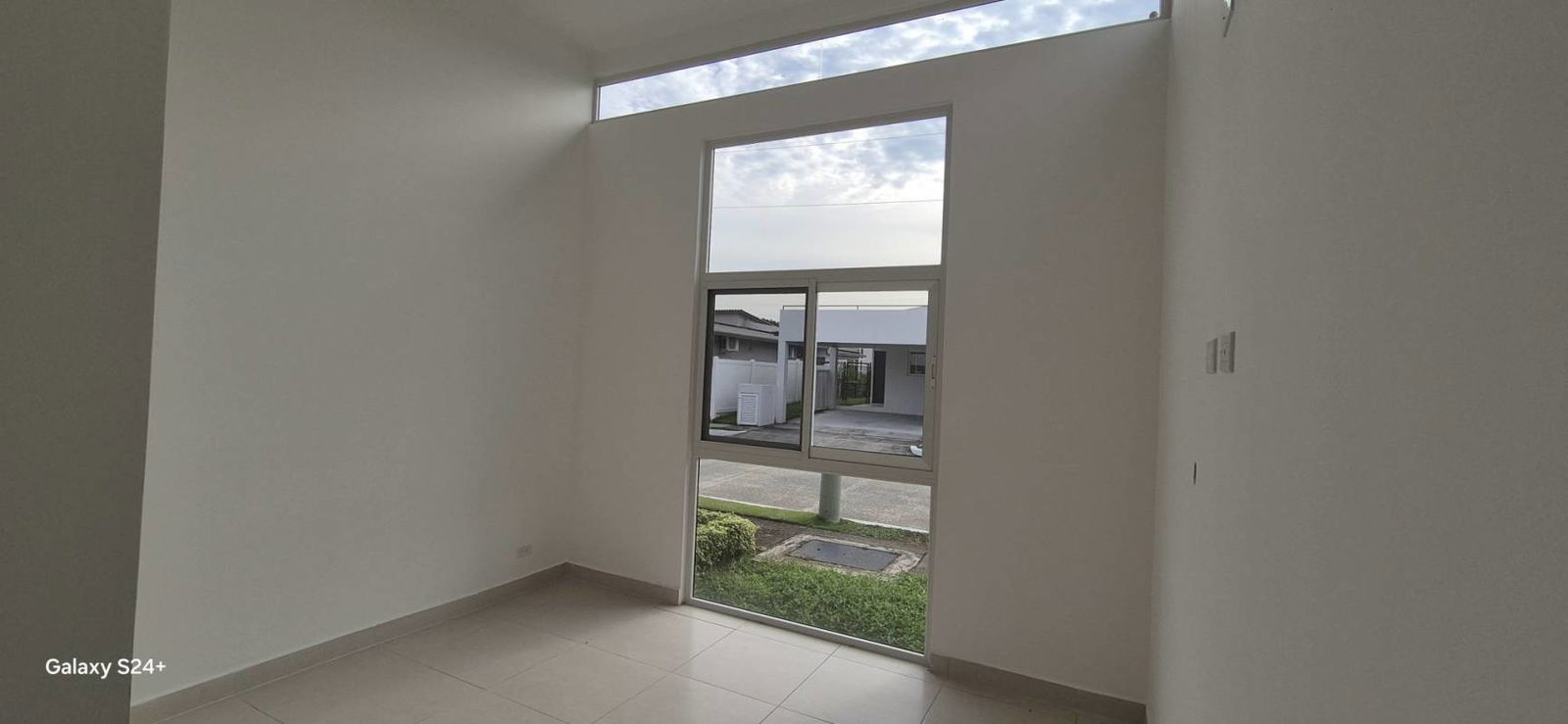Bathroom with glass shower enclosure, modern vanity, toilet in a new house in Villa Sur Costa Sur Panama