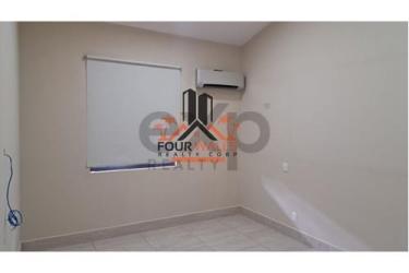 Living room with large windows and balcony access in PH River Village Panama Pacifico