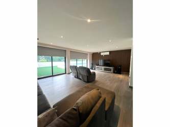 Private swimming pool with jacuzzi surrounded by garden for rent Panama Pacifico