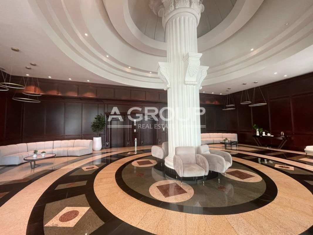 Elegant neoclassical lobby with seating, marble floors PH Balboa Tower Bella Vista Panama