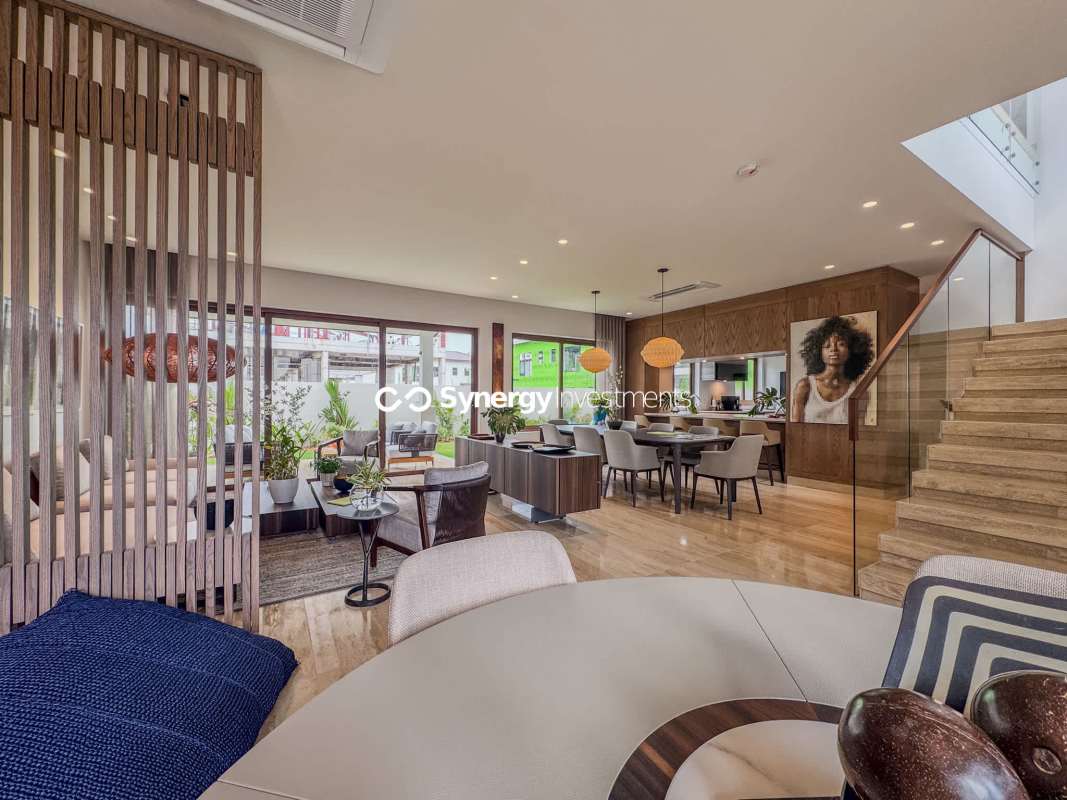 Kitchen with center island, marble countertops, wood cabinetry in luxury house at Santa Maria Golf & Country Club Panama