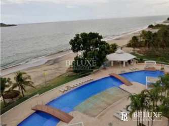 Guest bedroom with large windows and ocean view in PH Santa Clara