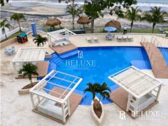 Aerial view beachfront pool and shaded gazebos PH Santa Clara Panama