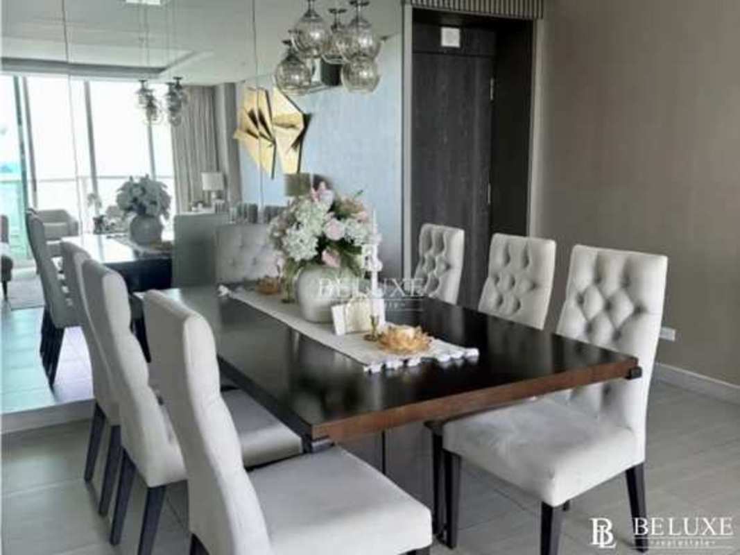 Main bedroom with floor-to-ceiling windows and ocean city skyline view PH Asia Costa del Este