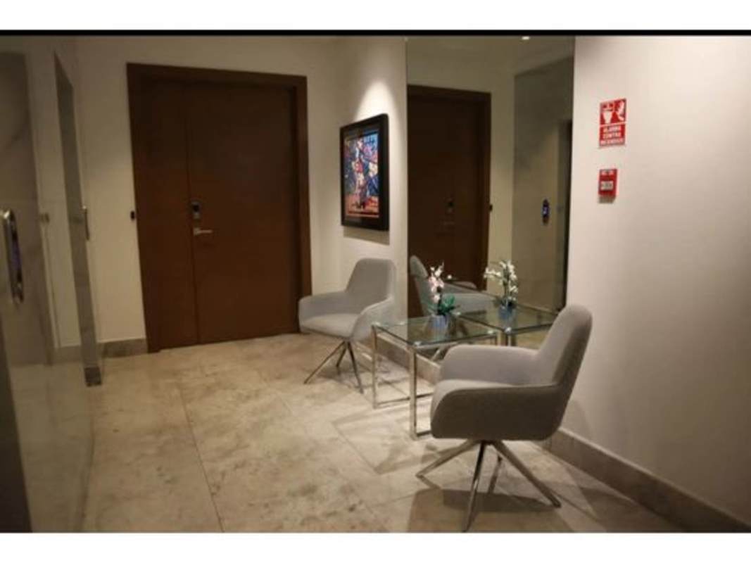 Modern gourmet kitchen with marble island, top appliances in Santa Maria luxury apartment PH Empire Residences