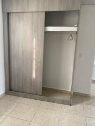 Bedroom with large built-in mirrored wardrobe and ceramic tile floor Villa Rosario Capira Panama