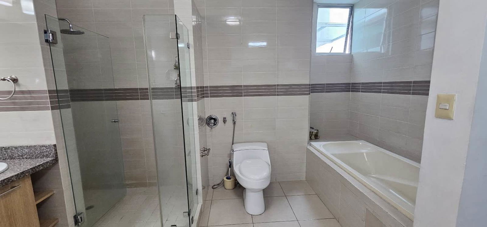 Modern dining room with panoramic skyline views and access to balcony at PH Tao San Francisco