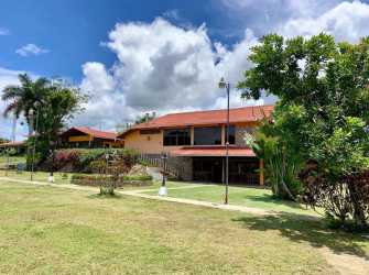 Bright restaurant interior with windows offering mountain views at Santa Clara Panama